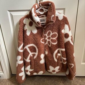 Sherpa jacket with mushroom, peace sign and various designs.